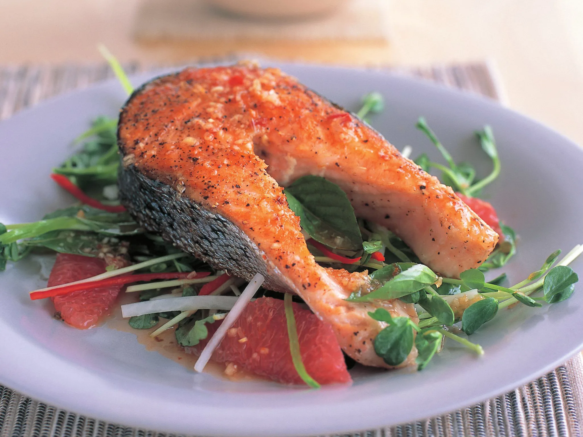 Salt and pepper salmon cutlets with daikon and snow pea salad