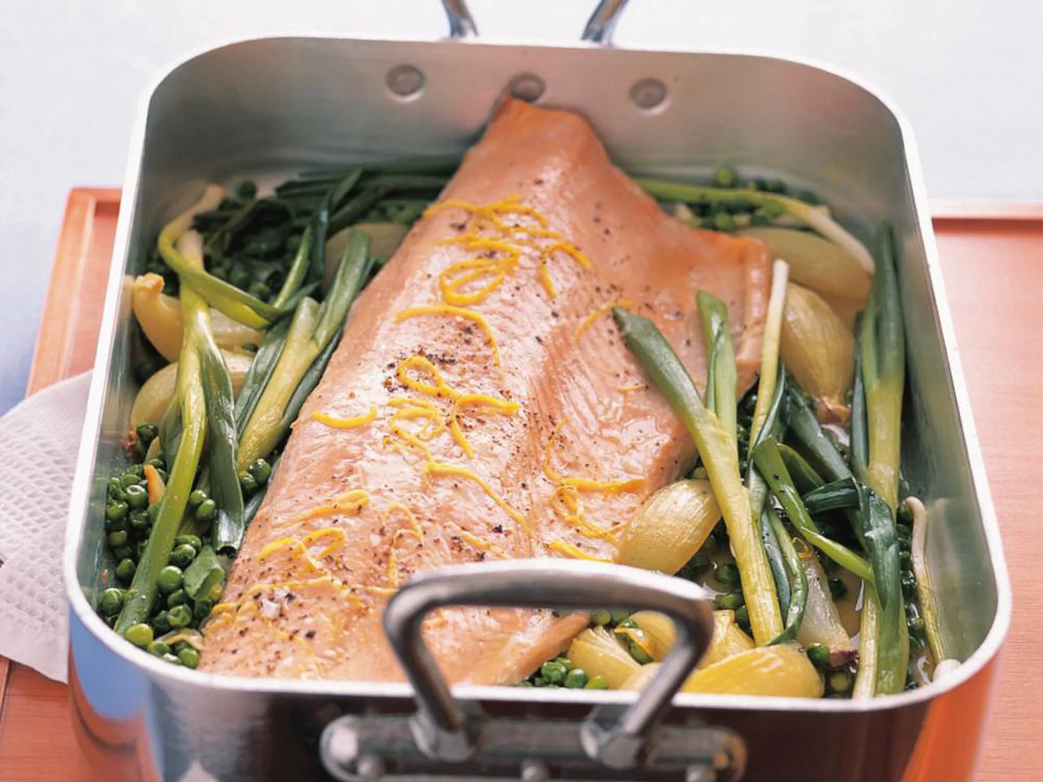 Slow-roasted salmon with green onions and peas