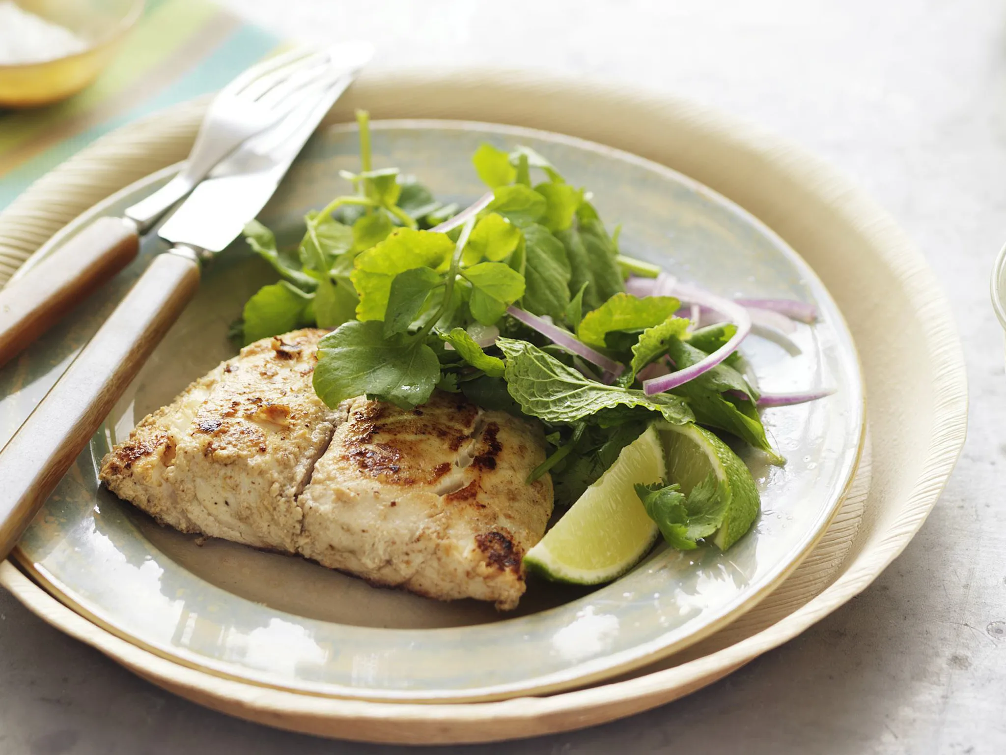 yogurt marinated fish with herb and watercress salad