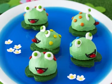 cheeky frogs in a pond
