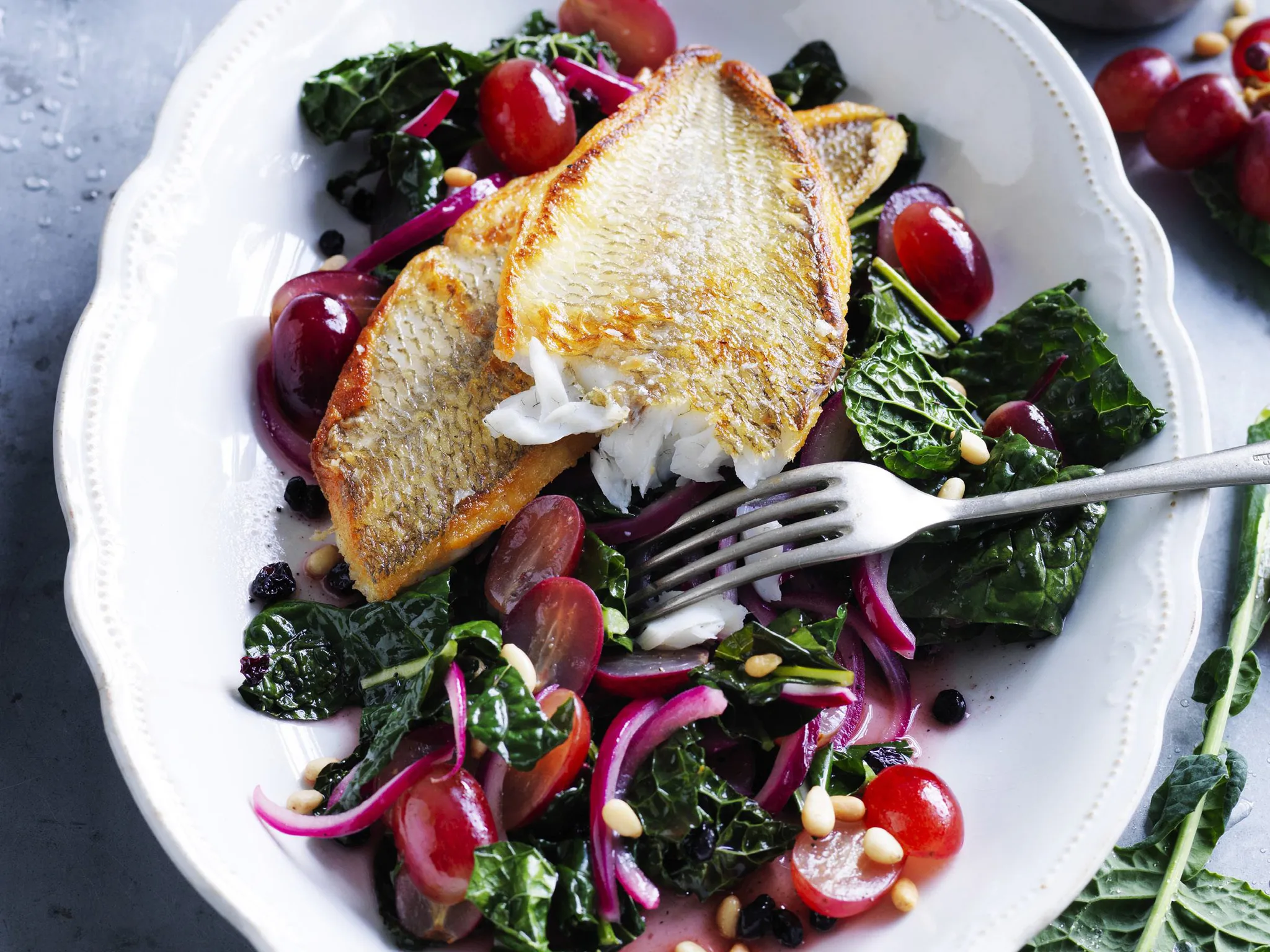 whiting with pine nuts, currants and tuscan cabbage