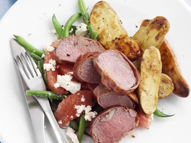 prosciutto-wrapped lamb with roasted kipflers