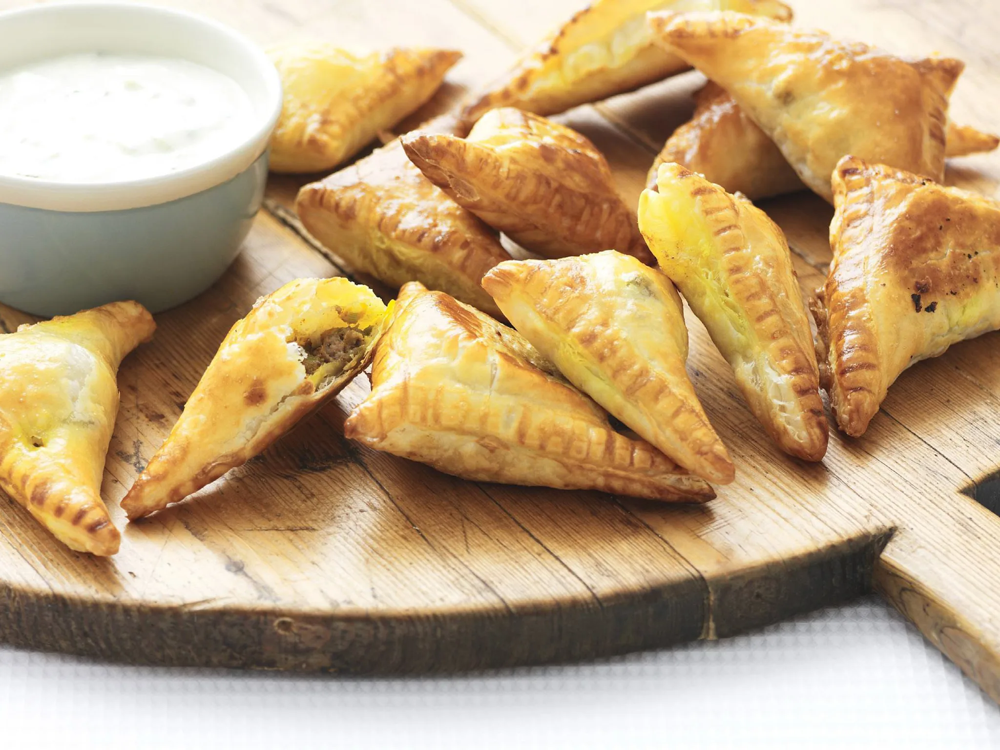 curried lamb puffs with cucumber raita