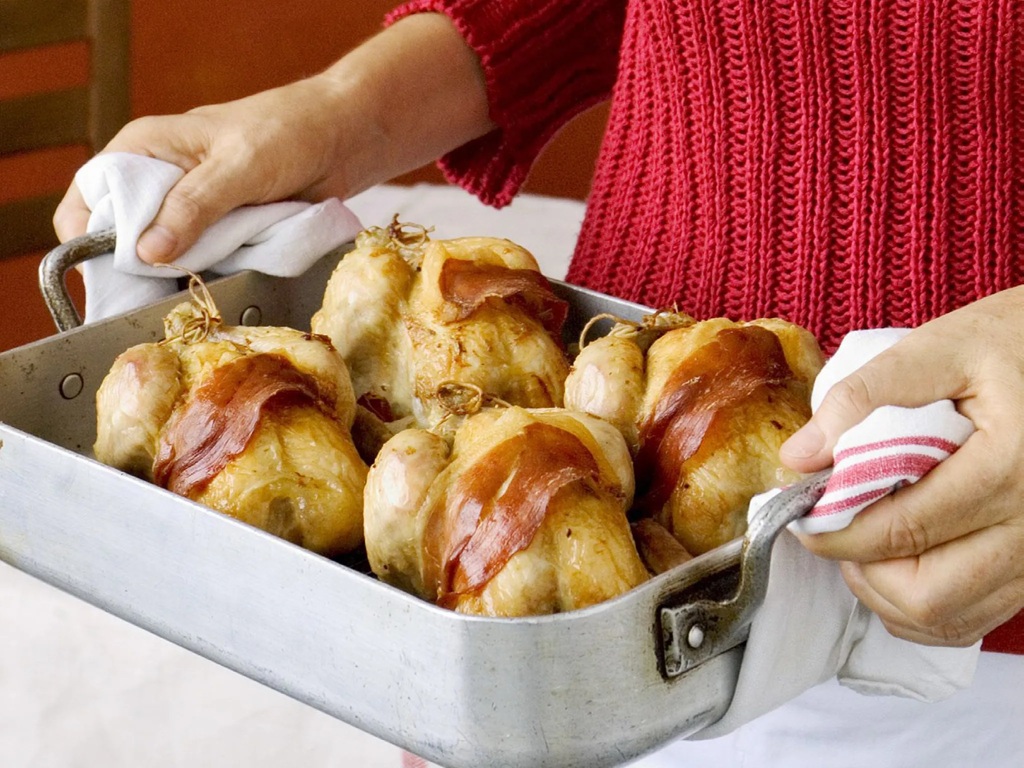 Prosciutto-wrapped chickens with lemon and sage