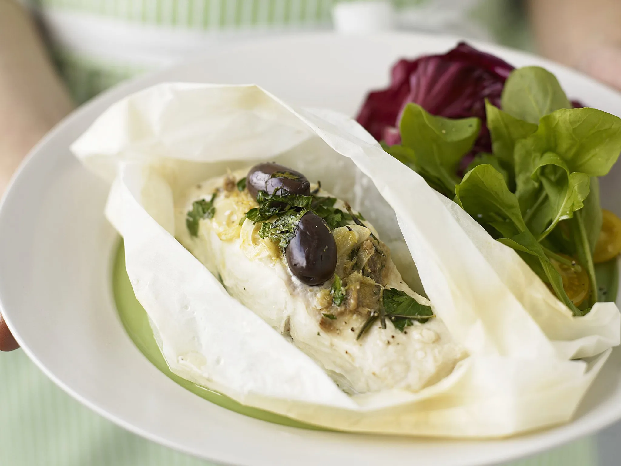 Fish parcels with anchovies and olives