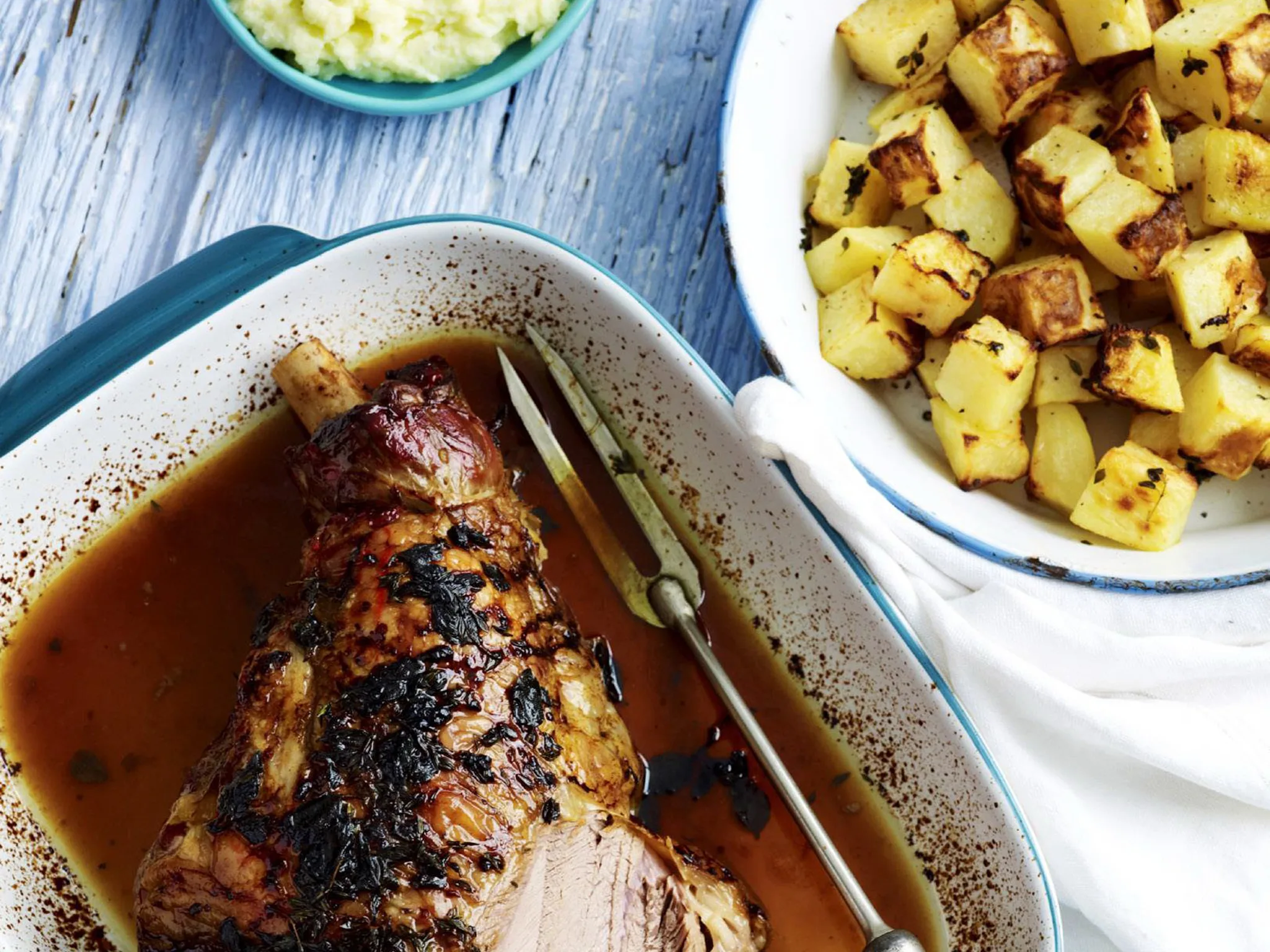 Slow-roasted lamb with skordalia and potatoes