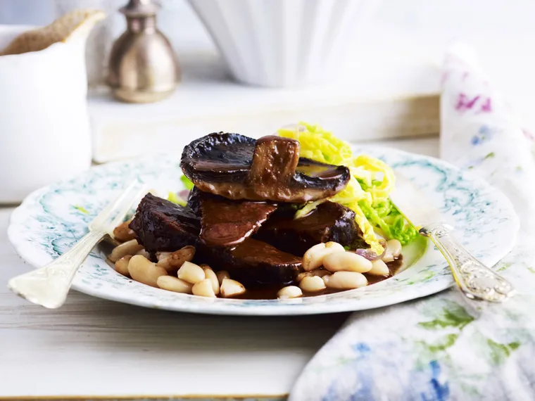 beef cheeks with mushrooms and braised cabbage