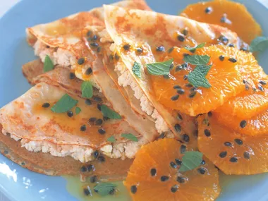 cheese-filled crepe triangles with caramelised oranges