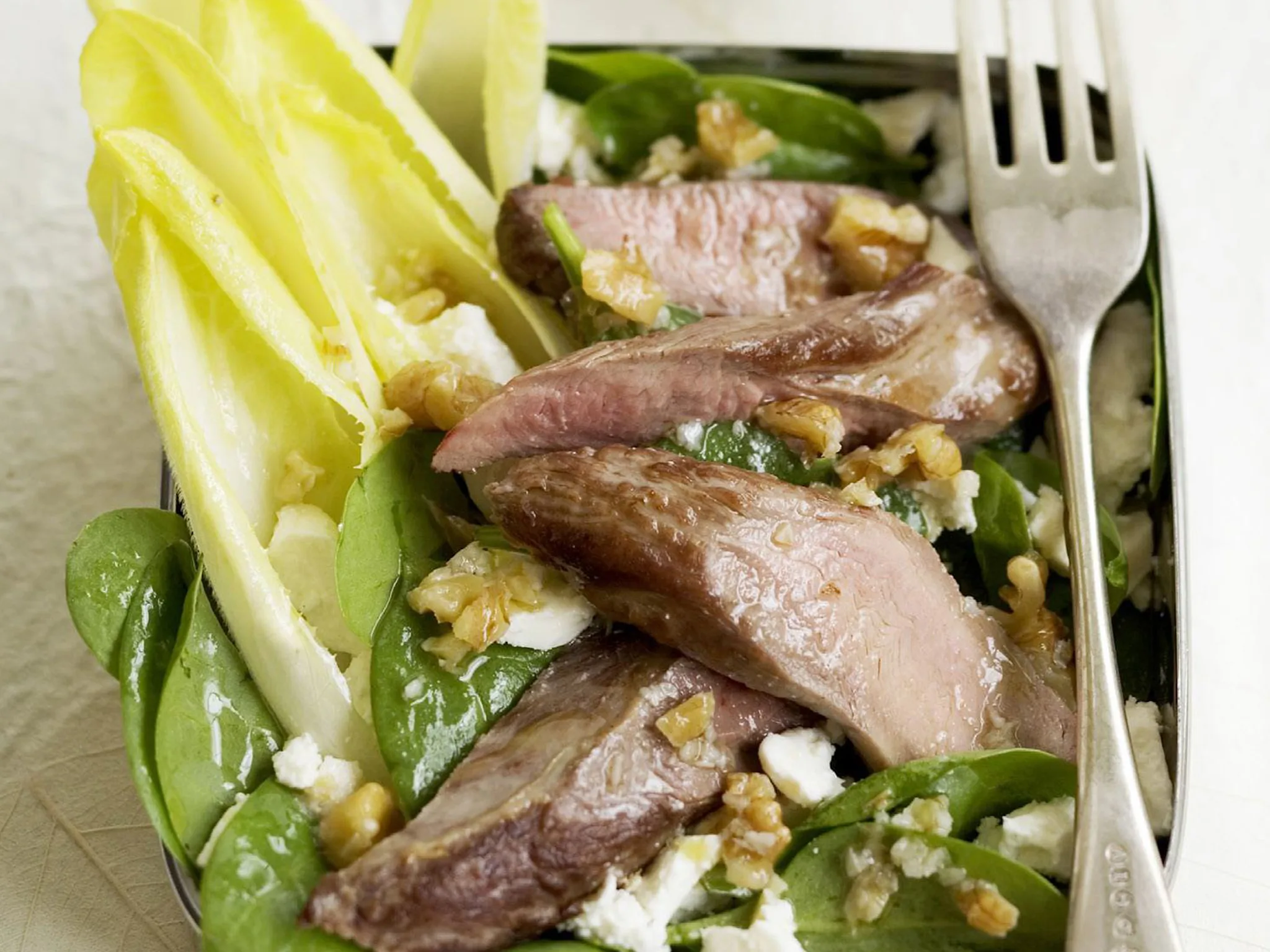 Lamb and fetta salad with warm walnut dressing