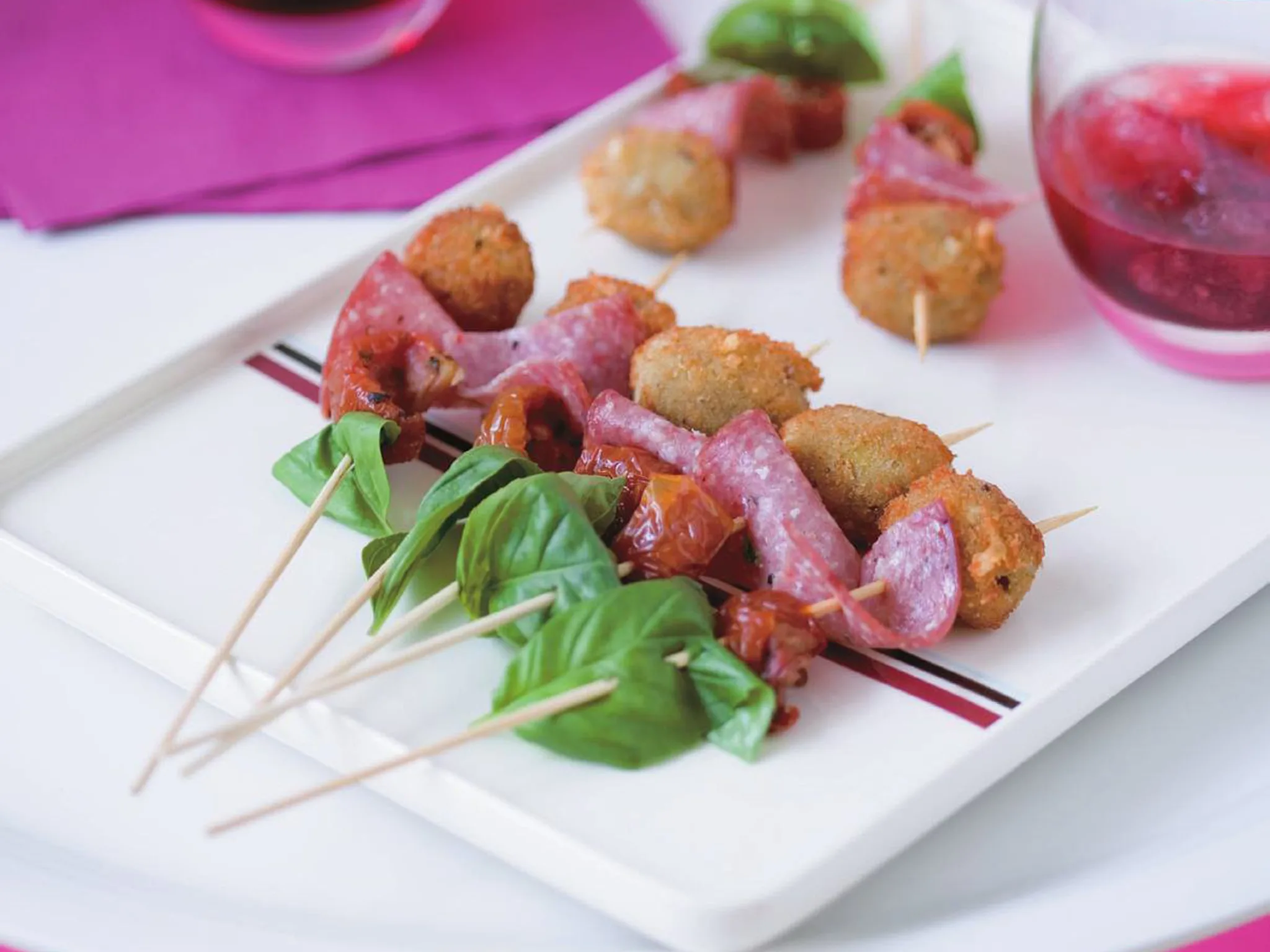 deep-fried olive, tomato and salami skewers