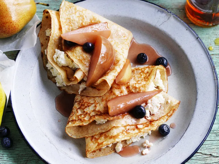spelt cr&ecirc;pes with poached pear and blueberries