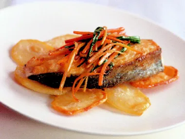 cod cutlets with potato crisps and gingered carrots