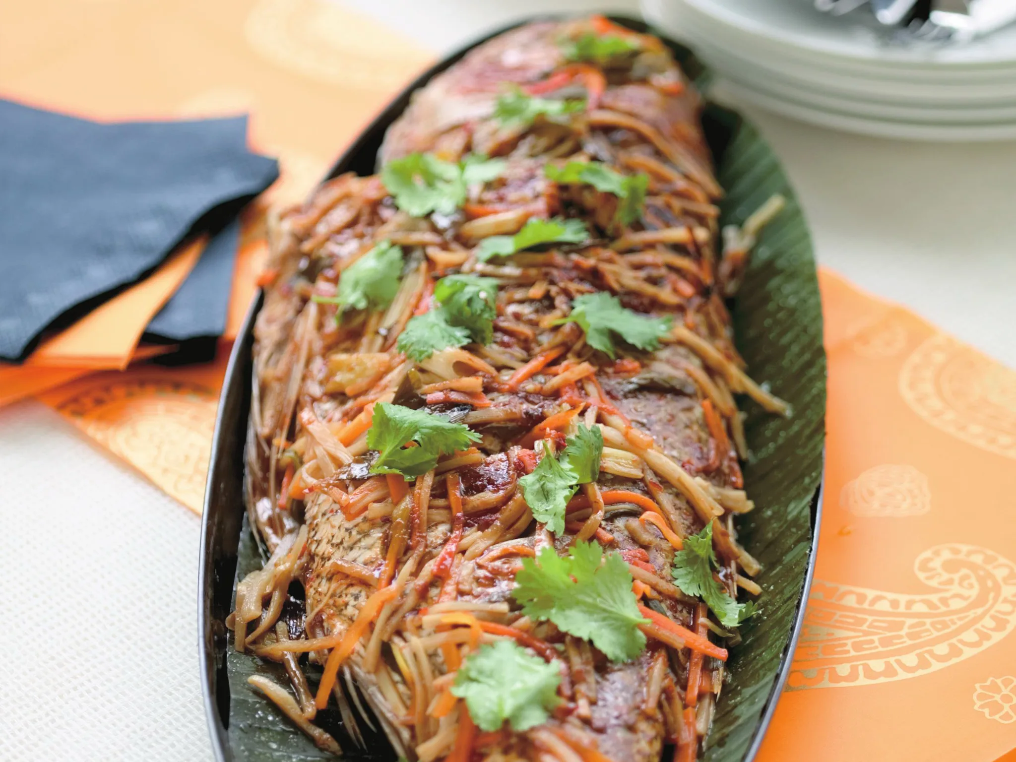 whole snapper wrapped in banana leaf