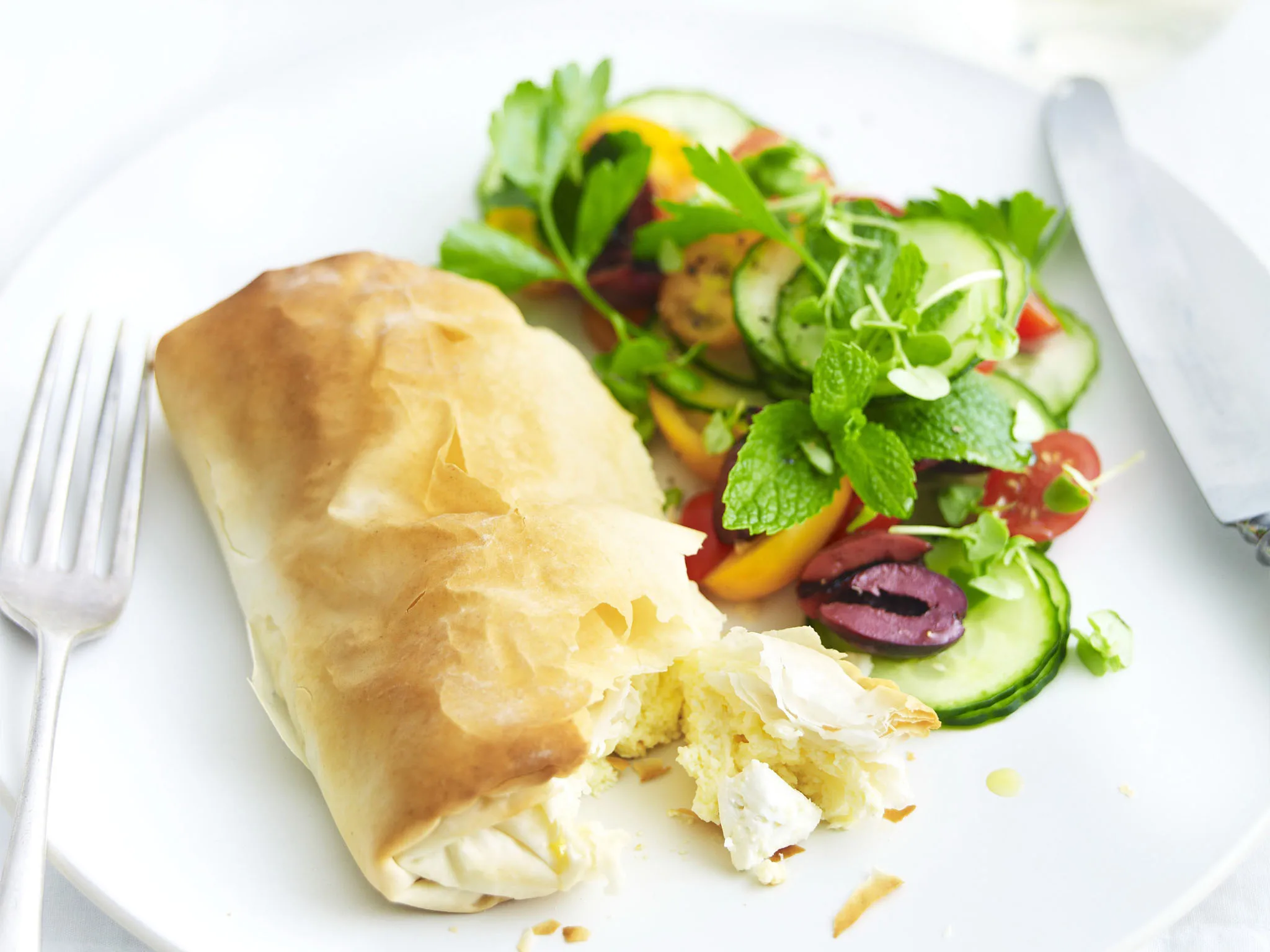 cheese parcels with tomato and olive salad