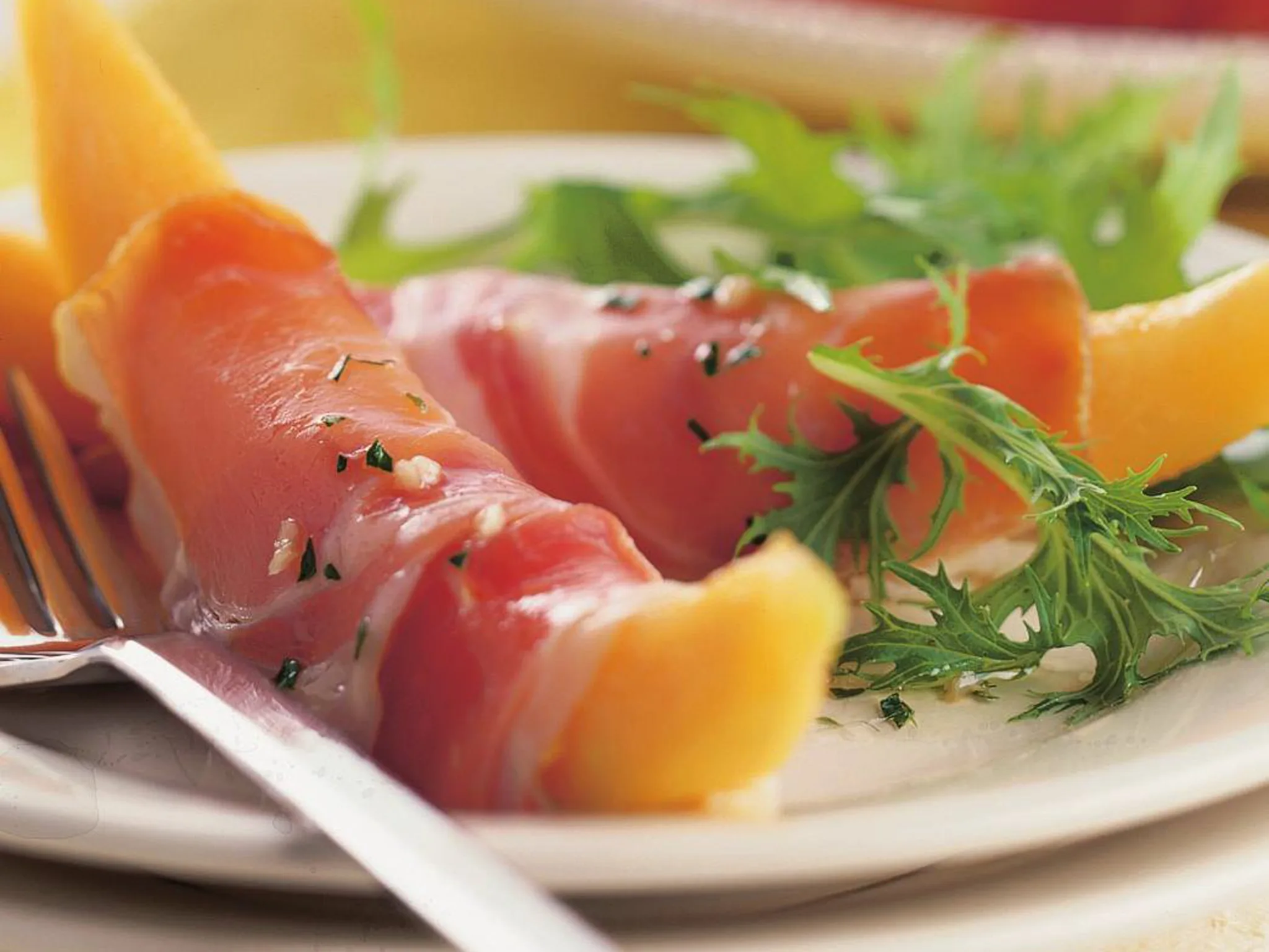 prosciutto-wrapped melon with vinaigrette