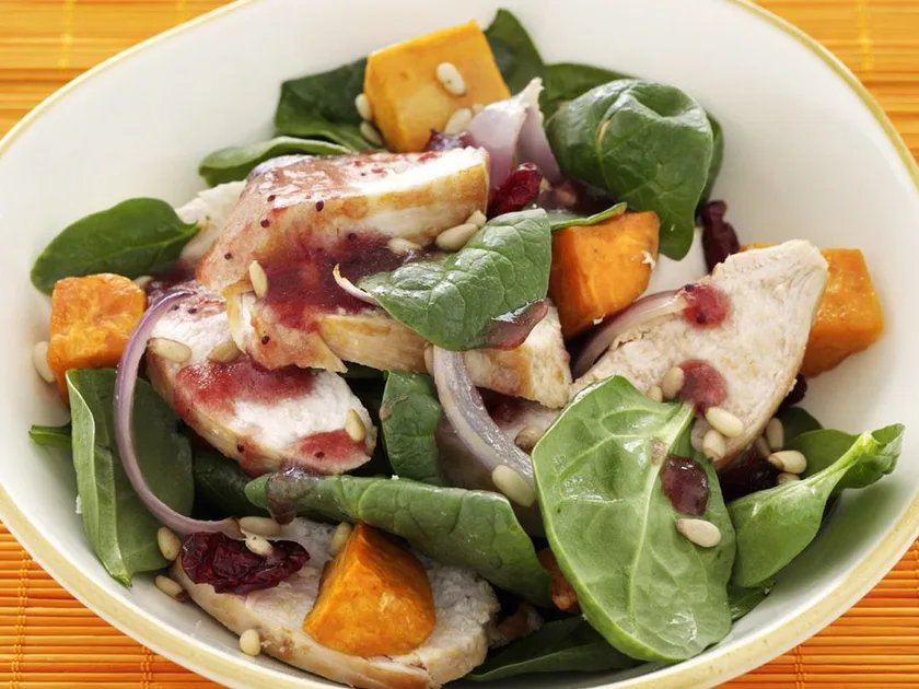 Chicken, roasted kumara, cranberry and spinach salad