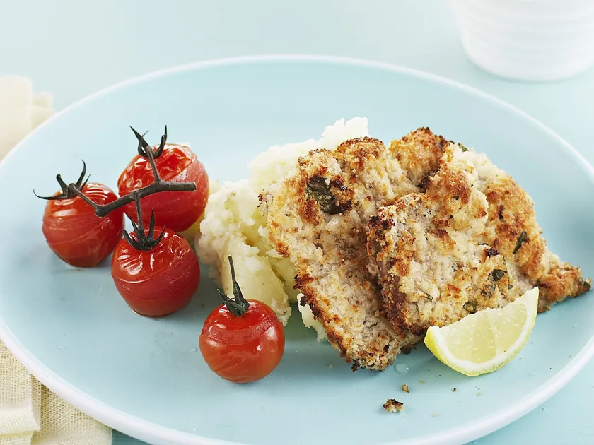 Veal Schnitzel, Potato Smash and Roasted Tomatoes