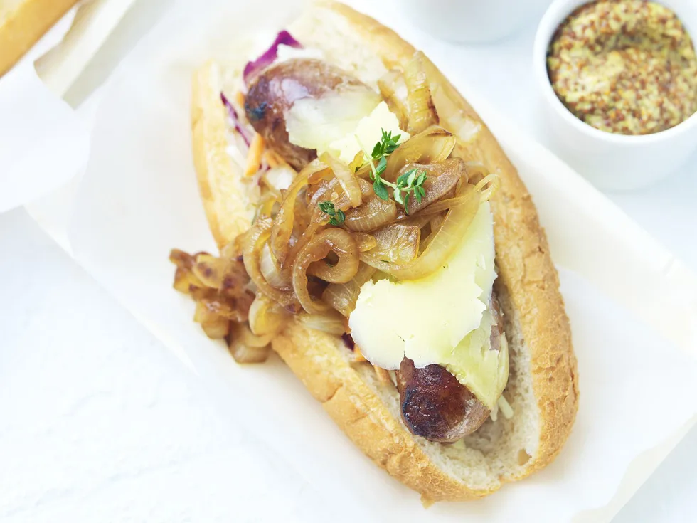 GOURMET HOT DOGS WITH CIDER-BRAISED ONIONS