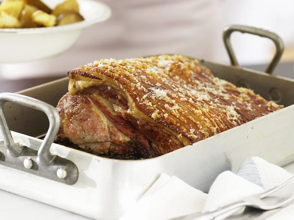 Roast pork with pears, apples and parsnips