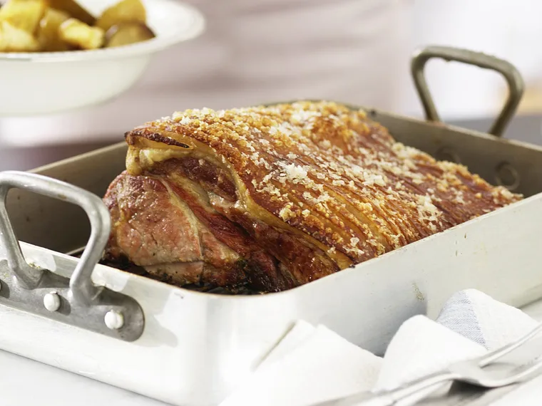 Roast pork with pears, apples and parsnips