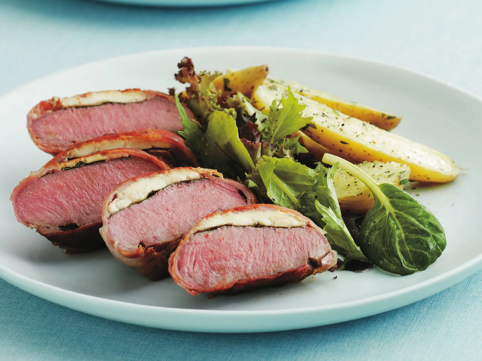 fetta, spinach and prosciutto lamb rolls with herbed kipflers