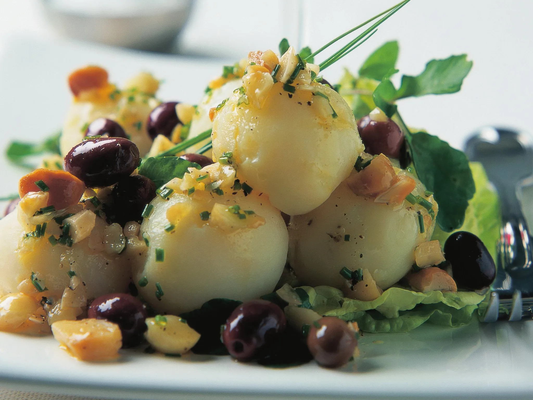 potato salad with olives and macadamias