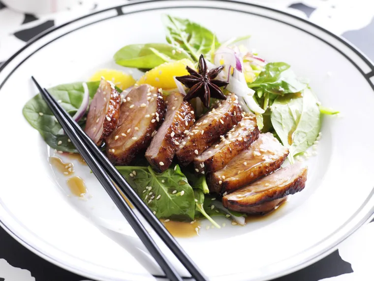 Roast duck with orange and snow pea salad
