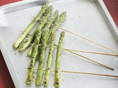 skewering asparagus