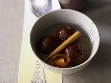 chocolate gulab jaman with orange cinnamon syrup