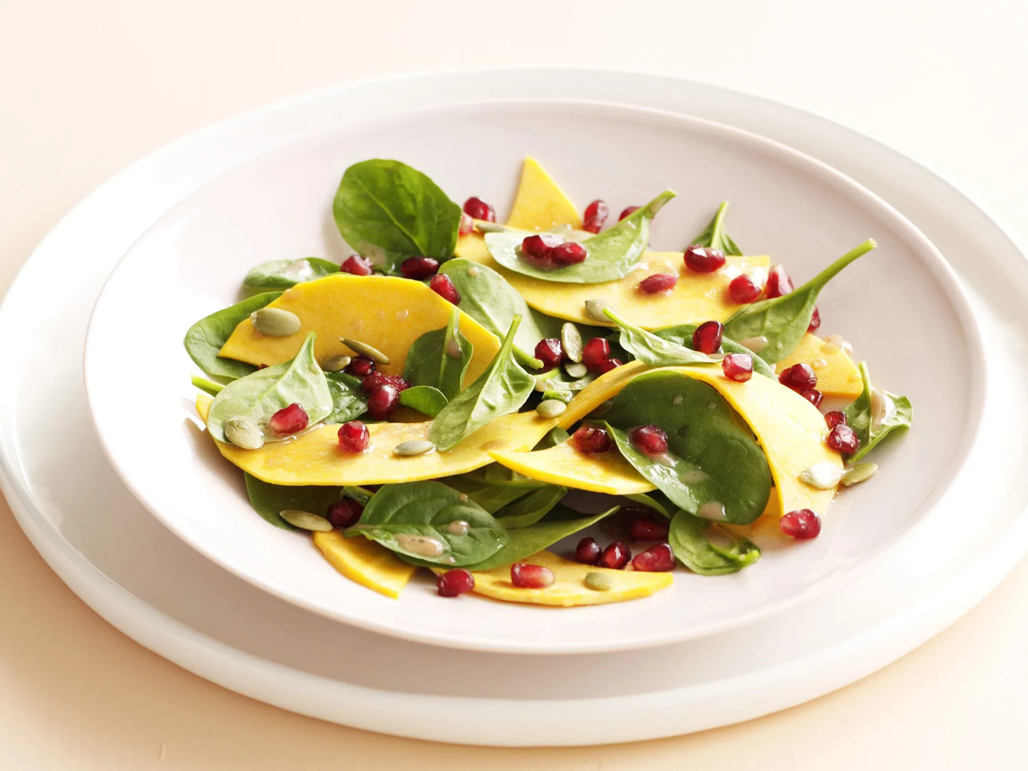 raw pumpkin, pomegranate and pepita salad