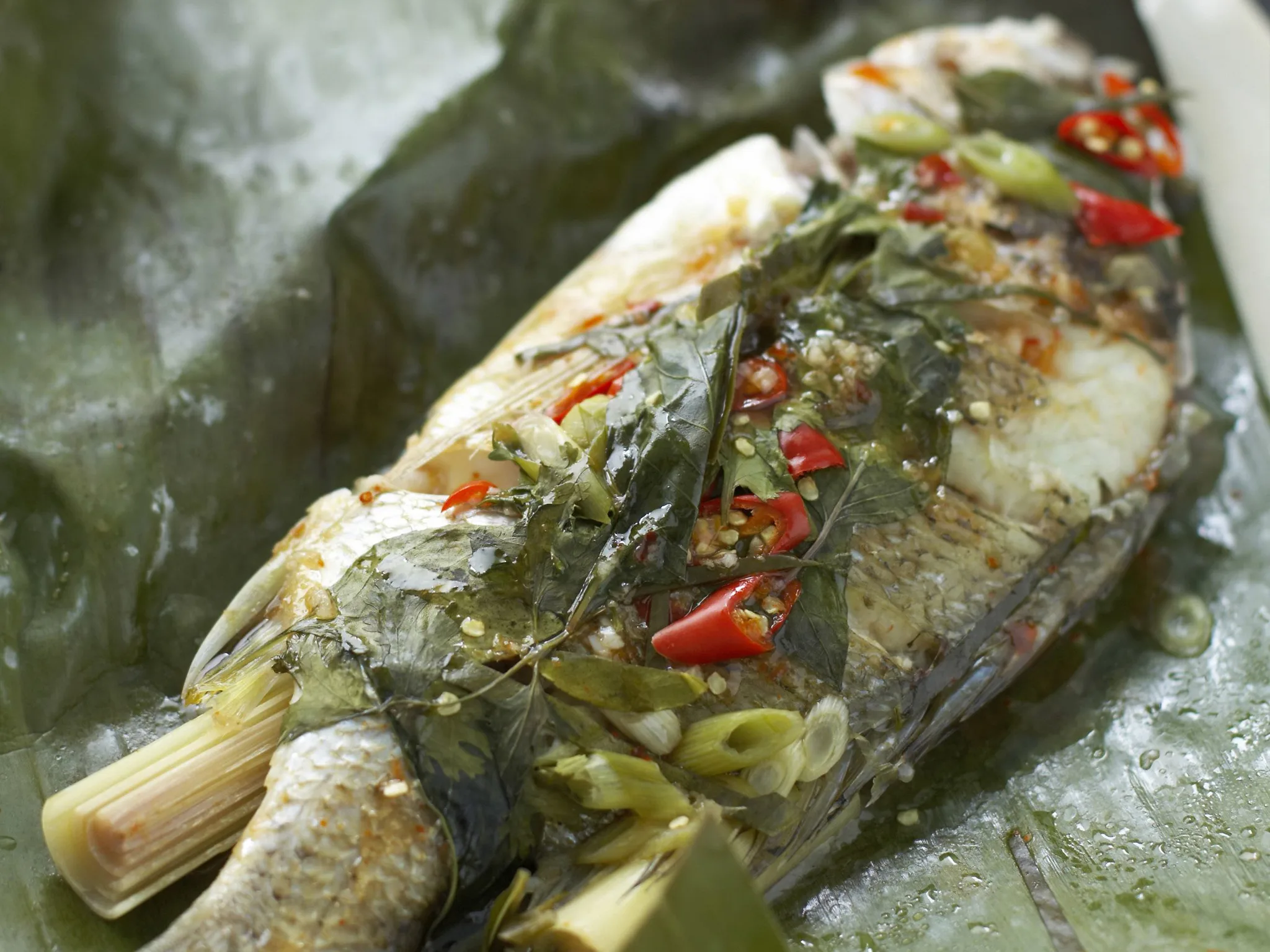 hot and sour fish steamed in banana leaves