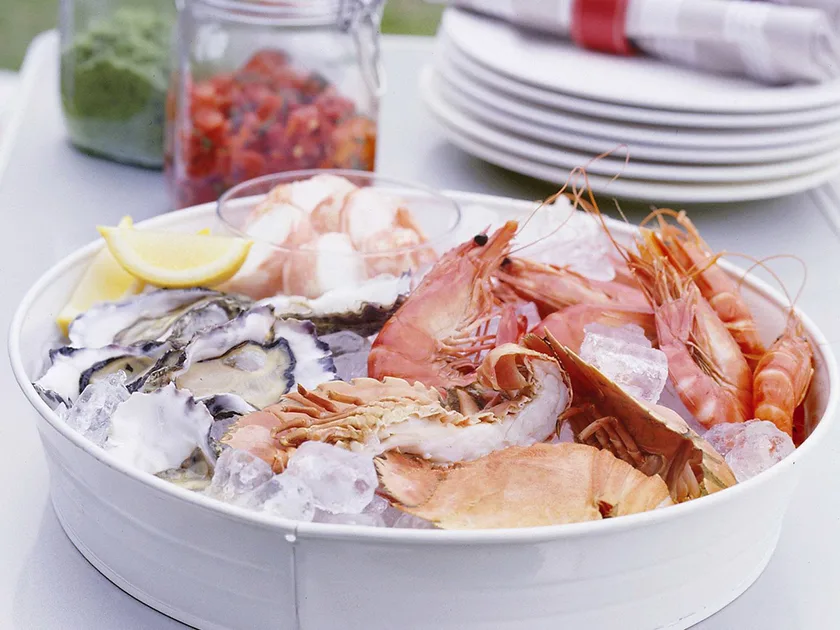 Cold seafood platter with herb sauce and salsa