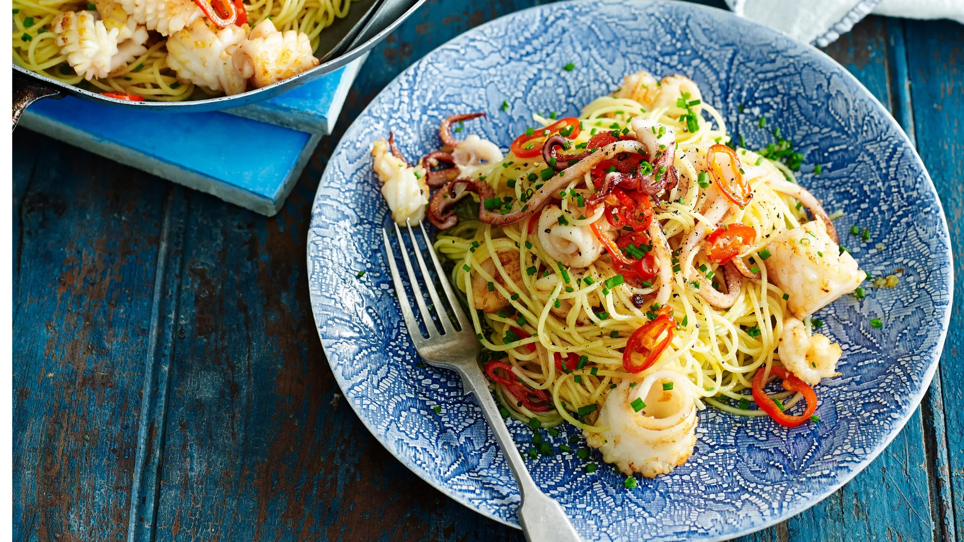 Calamari spaghettini topped with chilli and chives.
