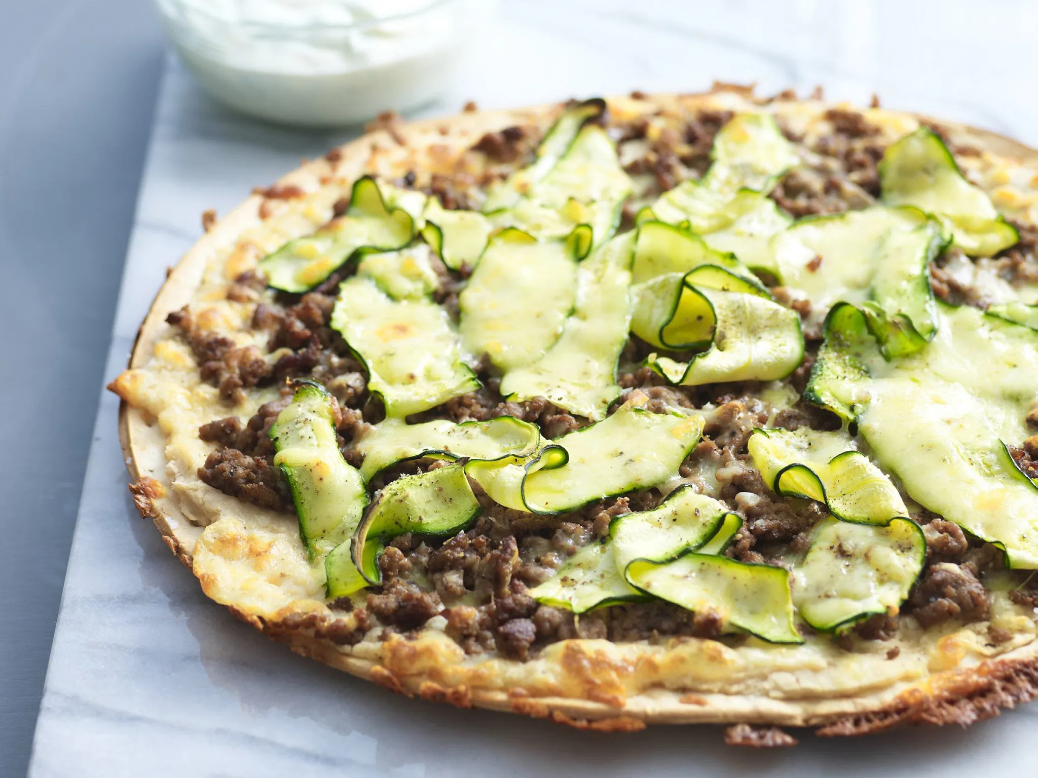 Beef, white bean and zucchini pizza