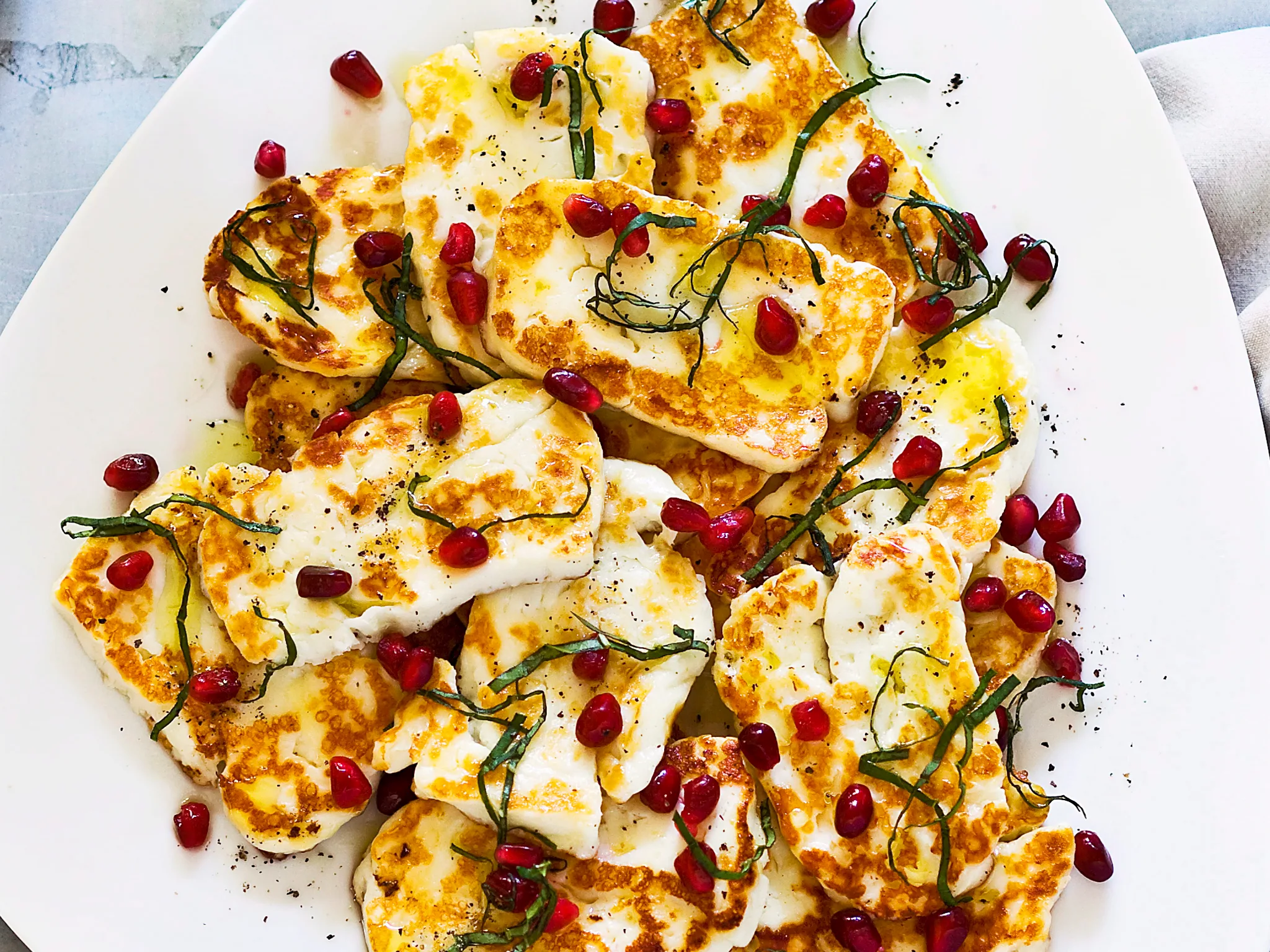 Haloumi with pomegranate and basil