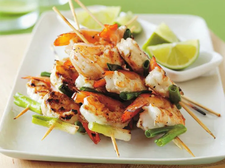 Prawn skewers with lime and green onions