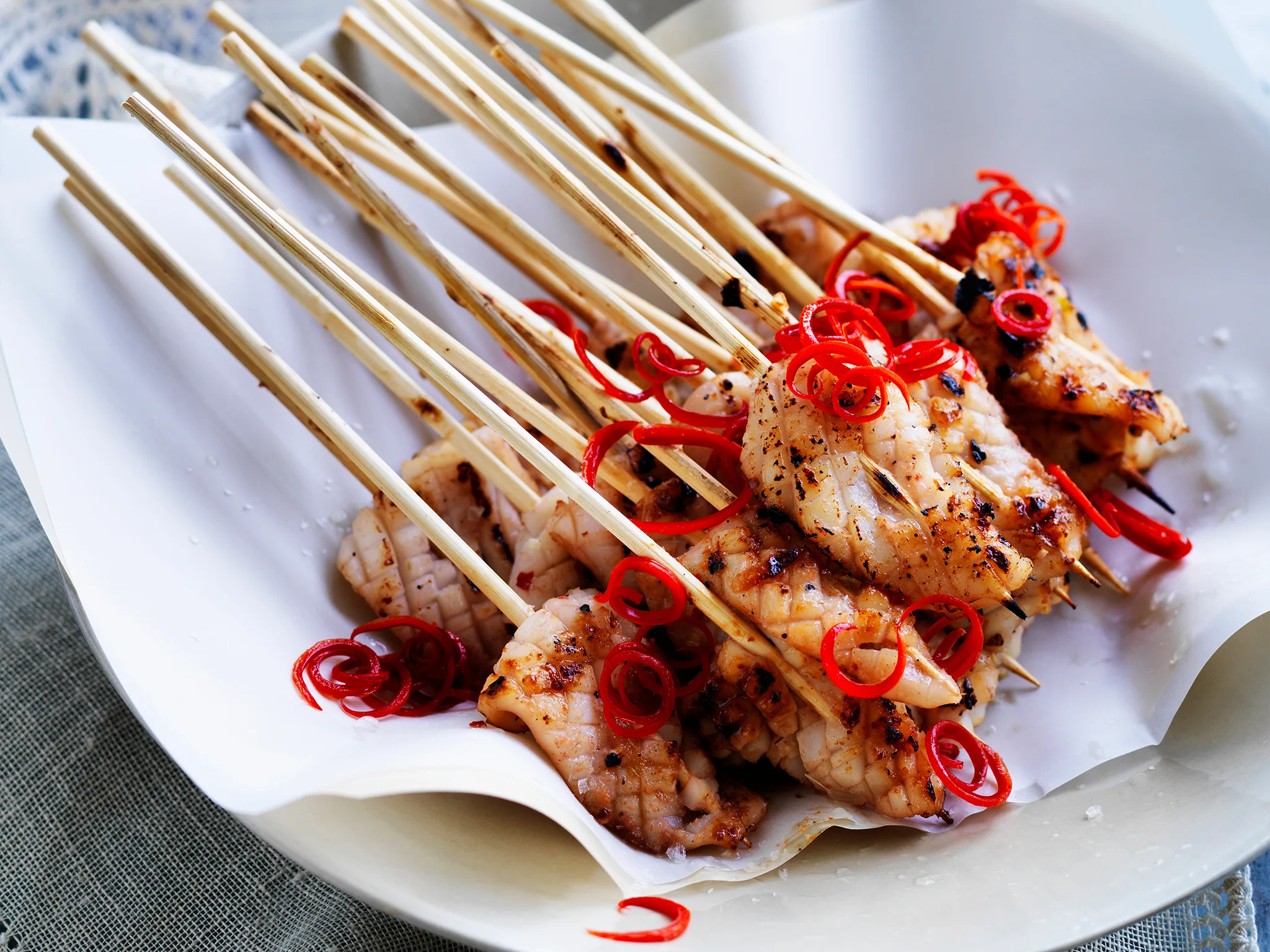 Barbecued squid on skewers