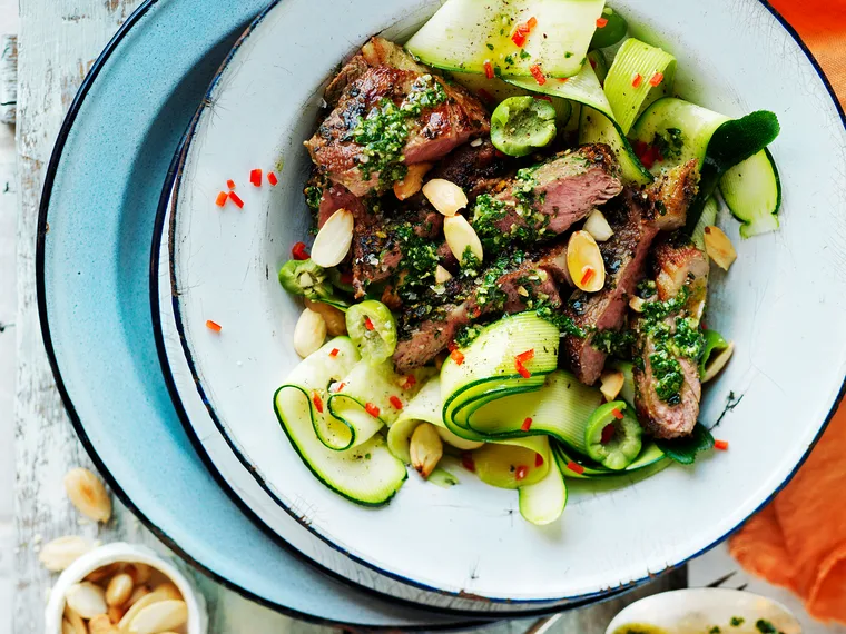 Pesto lamb with zucchini and almond salad