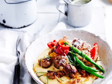 Sausages and capsicum with soft polenta