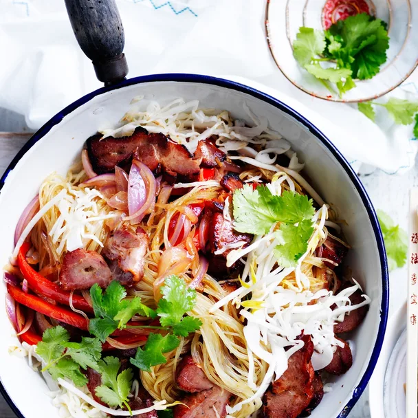 singapore noodles with bbq pork in a saucepan
