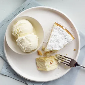slice of italian ricotta cheesecake with a bowl of ice-cream