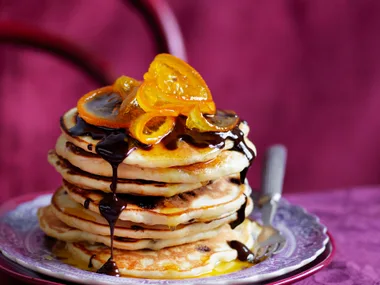 orange pancakes with chocolate sauce