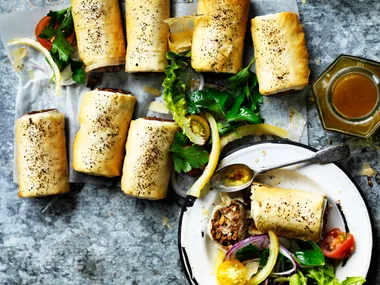 Lentil sausage rolls with tomato sumac salad