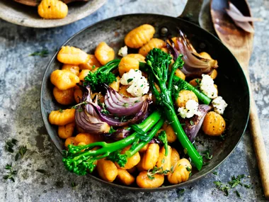 Pumpkin gnocchi with broccolini and red onion