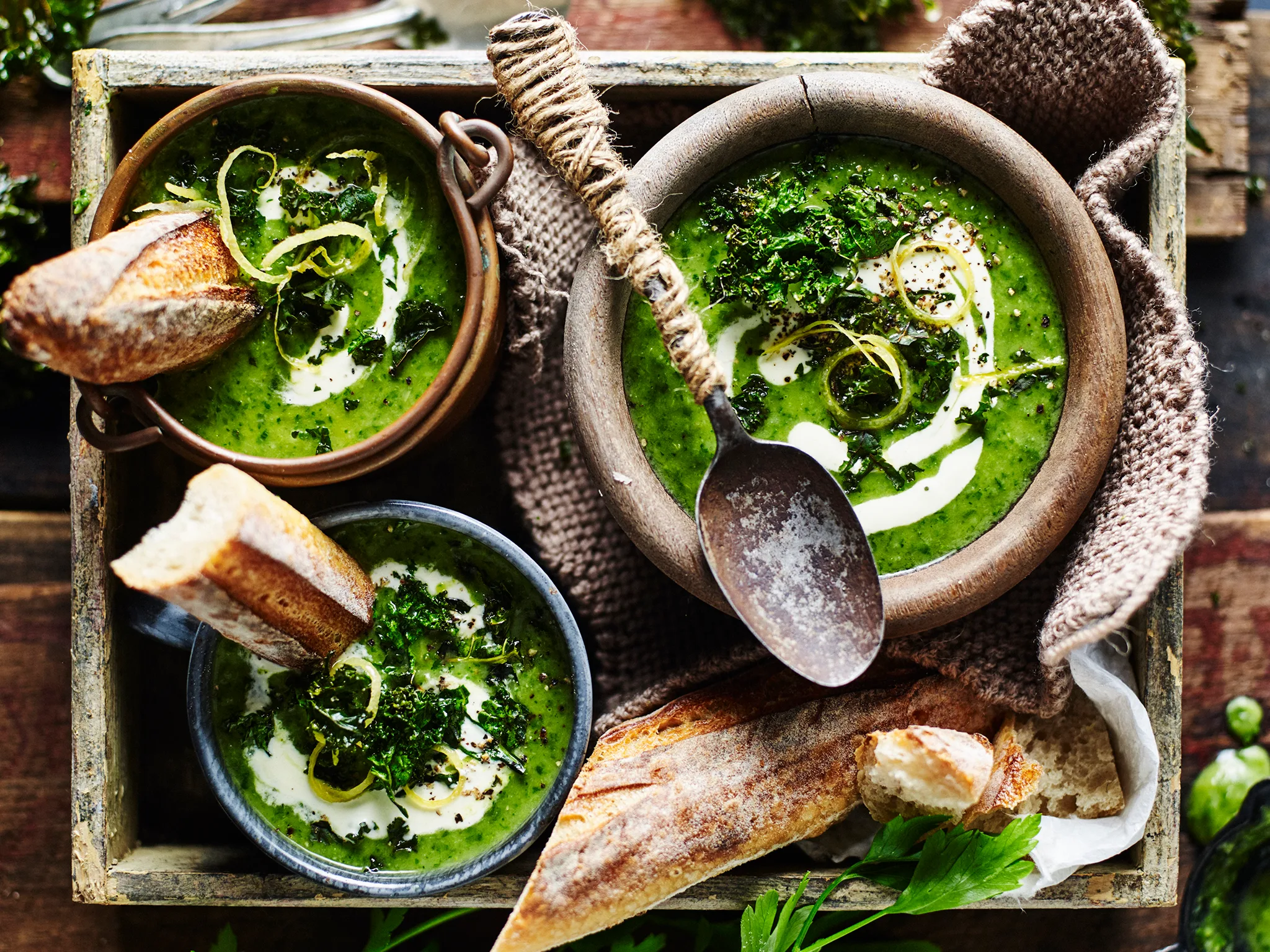 three bowls of broccoli soup