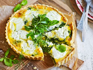 spinach and ricotta tart with two slices cut