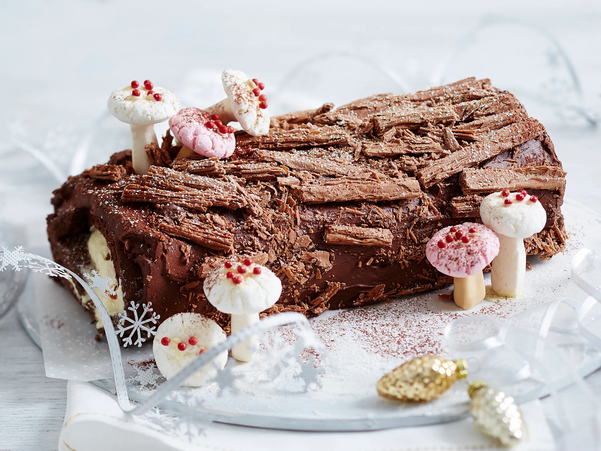 decorating a chocolate yule log