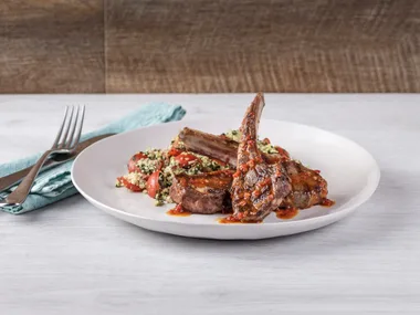 Lamb cutlets with harissa drizzle and tabbouleh