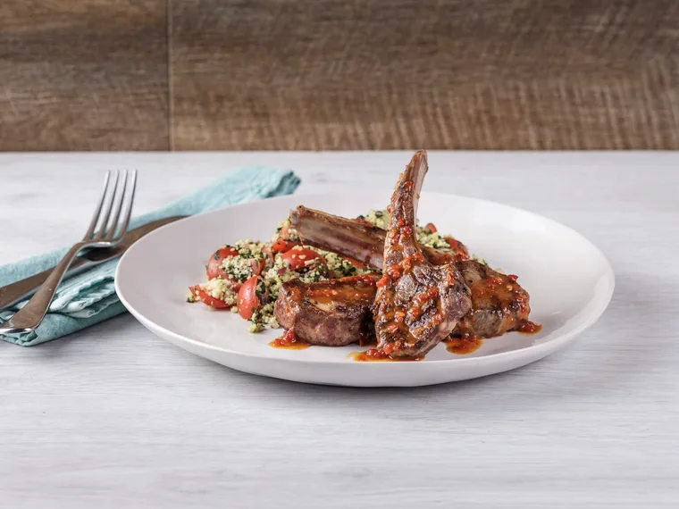 Lamb cutlets with harissa drizzle and tabbouleh