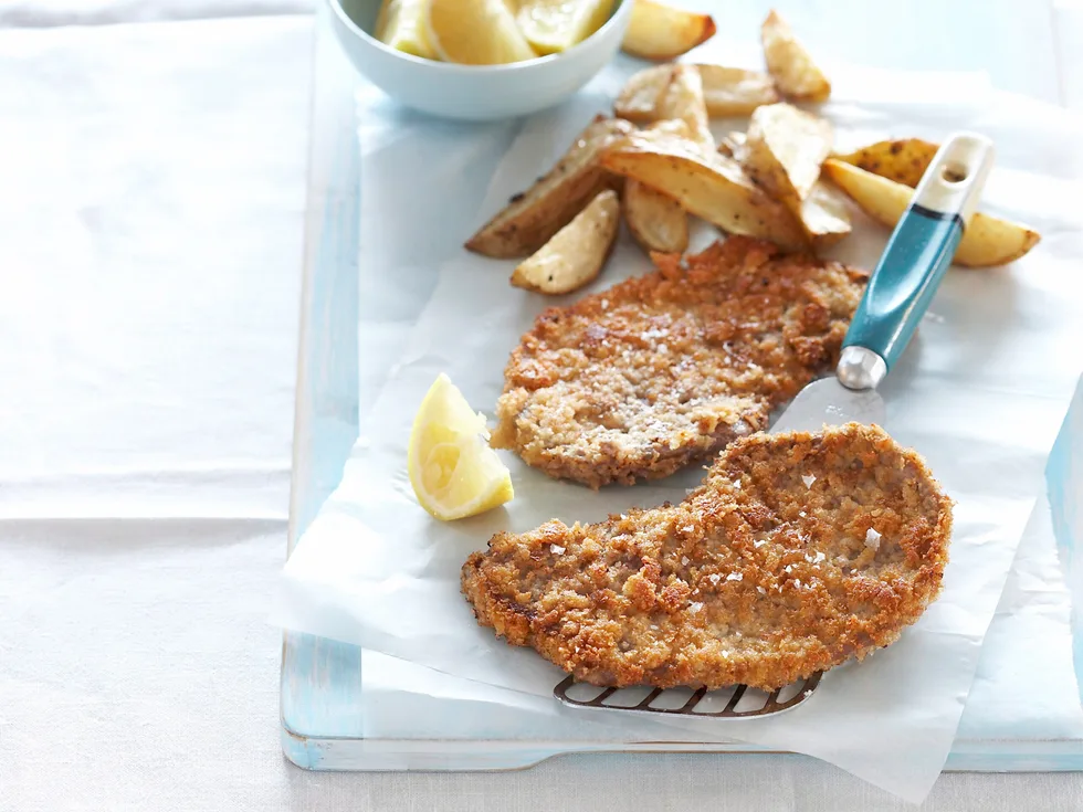 Oven-baked chicken schnitzel with spicy wedges